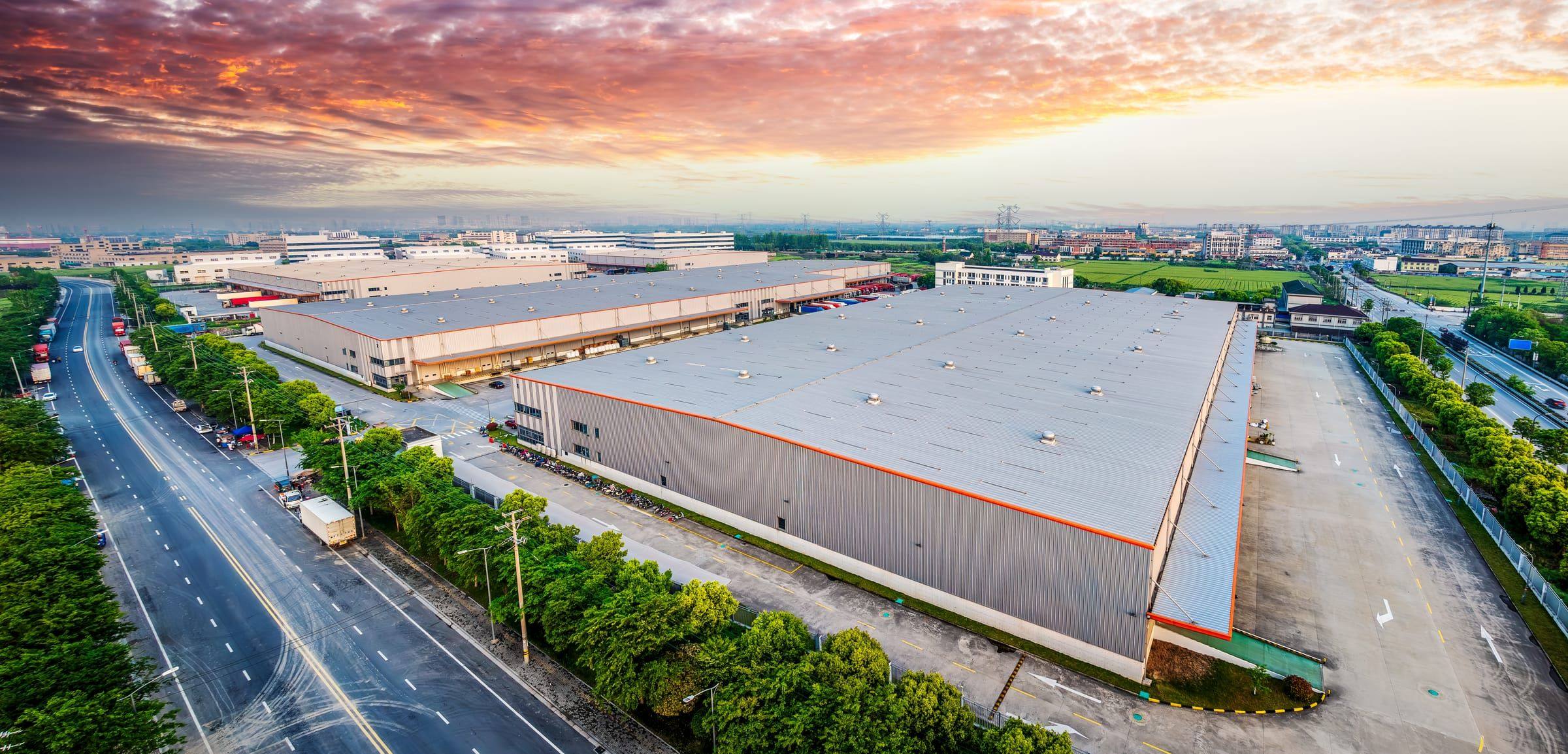 Aerial view of an industrial and logistics complex at dusk